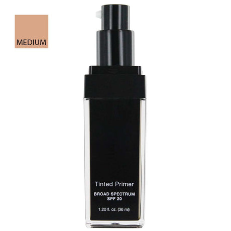 A bottle of tinted liquid primer with a black pump and black label on a clear rectangular bottle, shown on a white background with a beige color swatch labeled 'MEDIUM' in the top left.