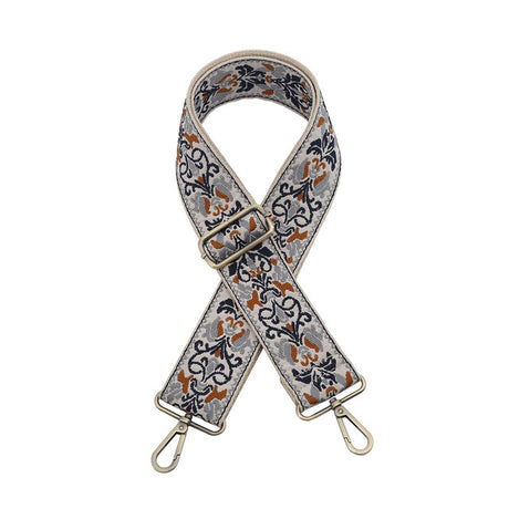 Floral patterned bag strap on a white background