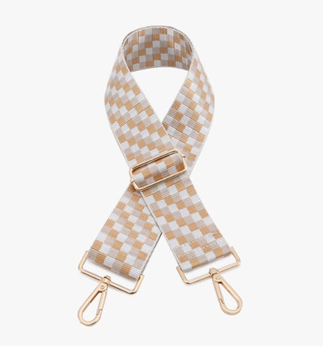 Checkered bag strap with gold hardware on a white background
