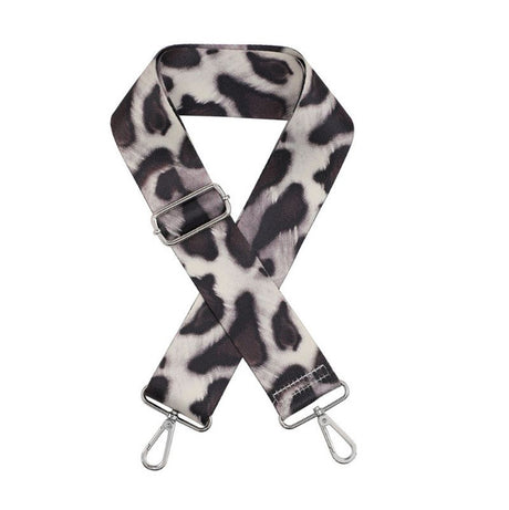 Cheetah print bag strap with metal clasps on a white background