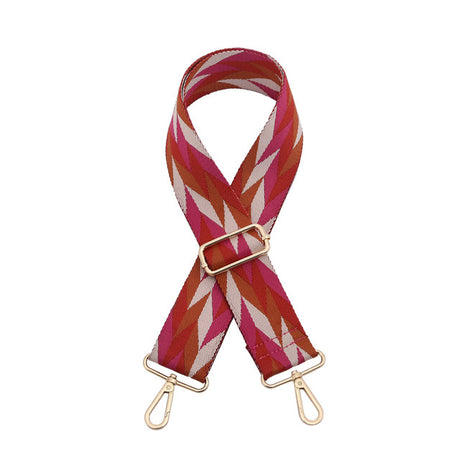 Striped bag strap with gold hardware on a white background