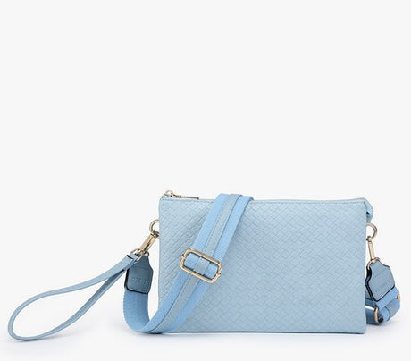 Light blue handbag with a strap on a white background