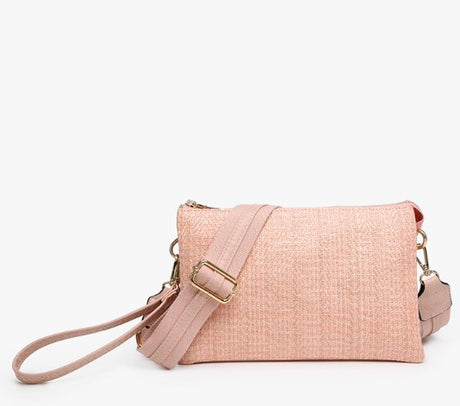 Pink textured handbag with a strap on a white background