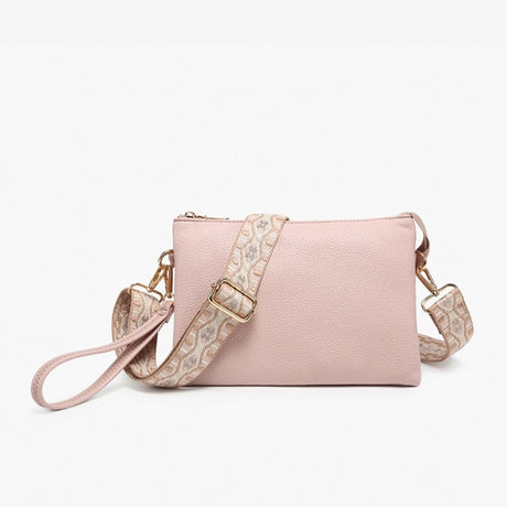 Pink handbag with floral strap on a white background