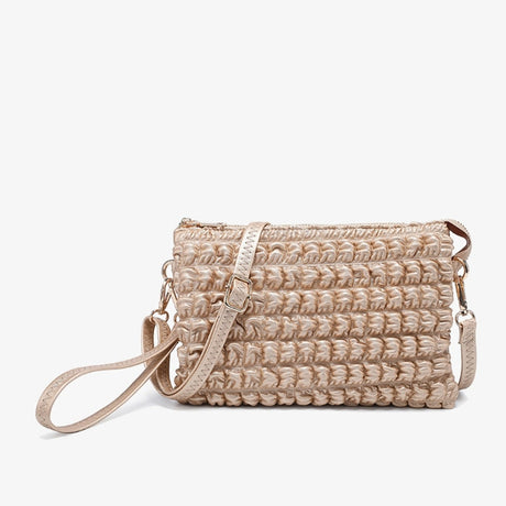 Bubble puffer light gold handbag with a strap on a white background