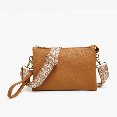 Camel vegan crossbody bag with a patterned strap on a white background