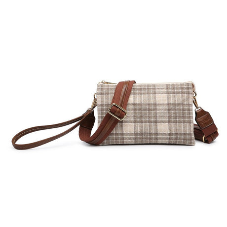 Plaid handbag with brown strap and accents on a white background