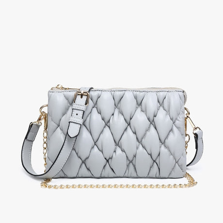 Quilted handbag with a chain detail on a white background
