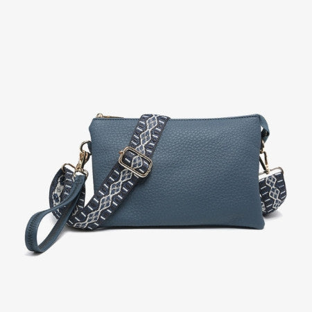 Slate Blue handbag with an embellished strap on a white background