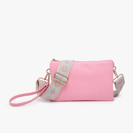 Pink handbag with a floral strap on a white background