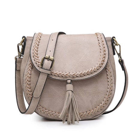 Warm Grey vegan leather handbag with braided detail and tassel on a white background