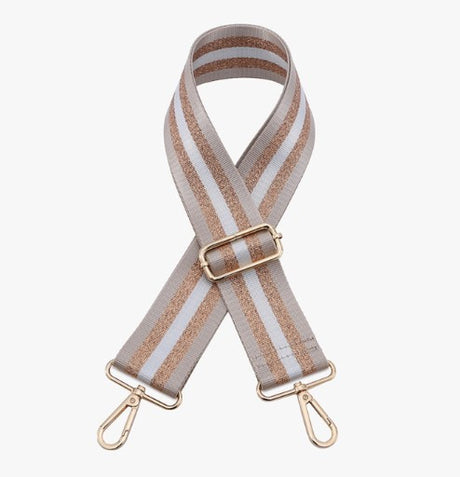 Striped bag strap with gold hardware on a white background