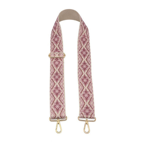 Patterned bag strap with gold hardware on a white background