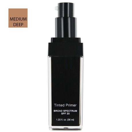 Annika Maya tinted primer in Medium Deep shade, shown in a black pump bottle labeled Broad Spectrum SPF 20.
