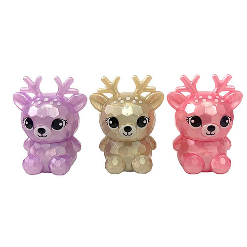 Three small cartoon deer figurines with antlers, shown side by side on a plain white background. The left deer is lavender-purple, the center deer is metallic gold, and the right deer is pink.