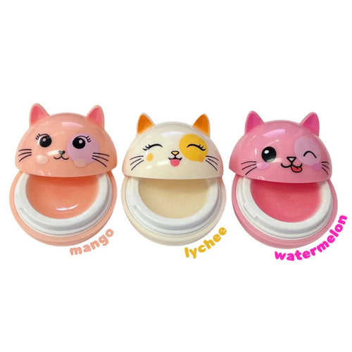 Three cat-face lip balm pots on a white background, labeled mango, lychee, and watermelon. The left pot is peach-pink, the middle is cream with a yellow winking eye, and the right is pink.
