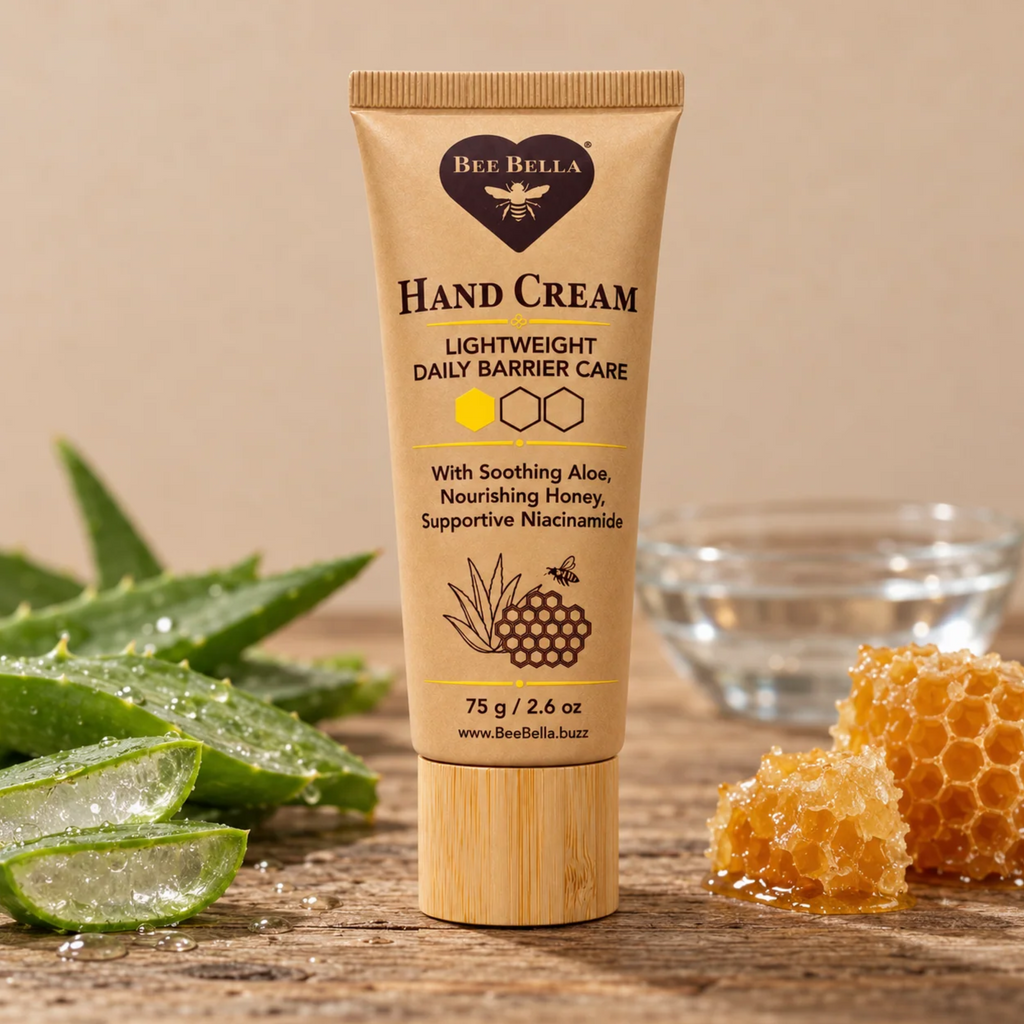 Bee Bella Lightweight Daily Barrier Care Hand Cream on counter with bees wax and aloe leaves in the background