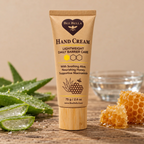 Bee Bella Lightweight Daily Barrier Care Hand Cream on counter with bees wax and aloe leaves in the background