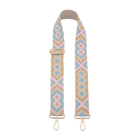 Patterned bag strap with gold hardware on a white background