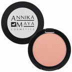 Compact blush with open lid showing blush color and Annika Maya Cosmetics logo.