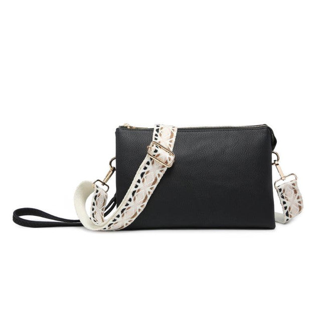 Black clutch bag with a decorative white strap on a white background