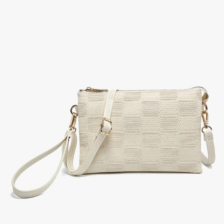 Beige woven handbag with a strap on a white background