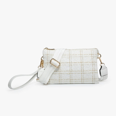 White textured handbag with gold accents on a white background