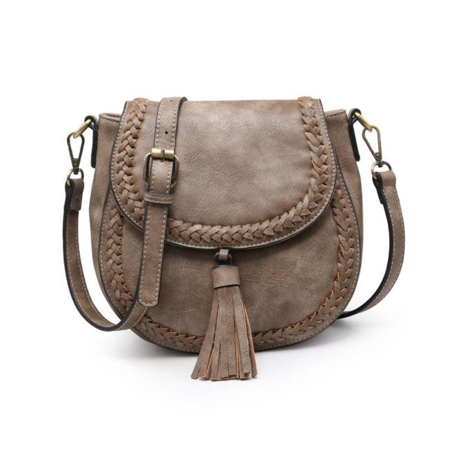 Clay vegan leather crossbody bag with braided details and a tassel on a white background