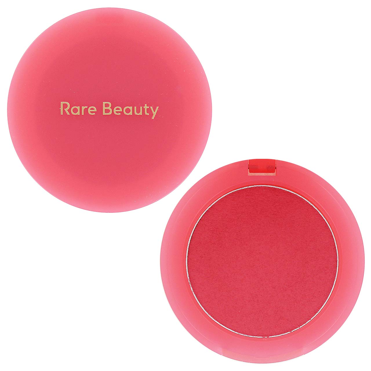 Rare Beauty blush compact shown open with the pink cap beside it, featuring the brand name in gold lettering on the lid. The compact contains a vibrant pink pressed powder blush.