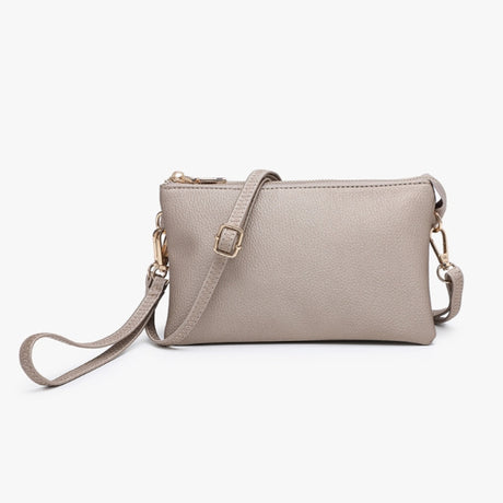A light taupe pebbled leather crossbody bag with a matching adjustable strap and gold-tone hardware, shown on a clean white background.