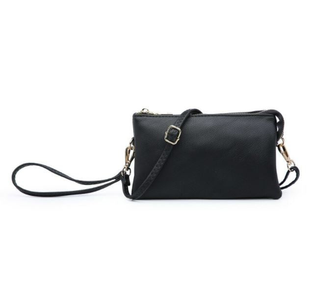 Black vegan leather crossbody bag with a strap on a white background
