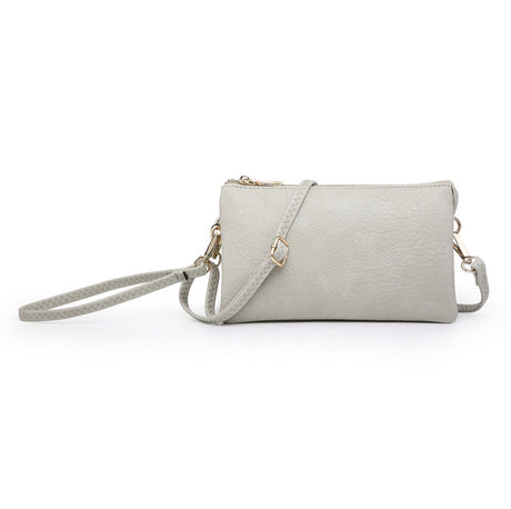 Bone colored handbag with a strap on a white background