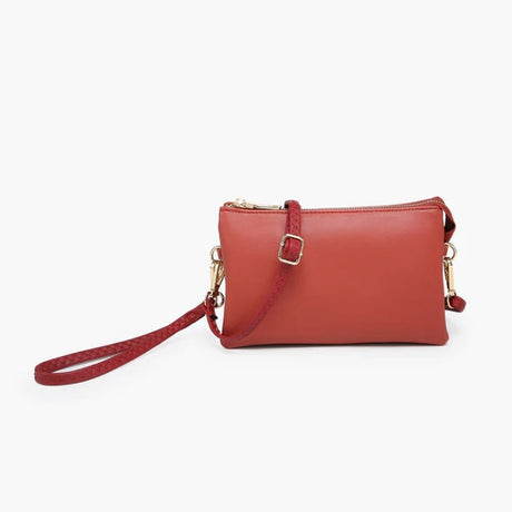 Brick Red handbag with a strap on a white background