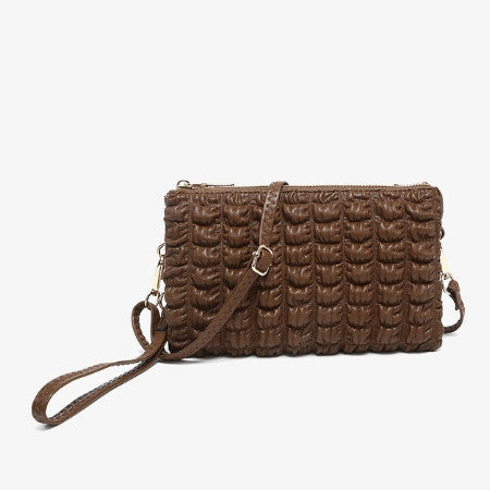 Riley Bubble Puffer Chocolate handbag with a strap on a light gray background