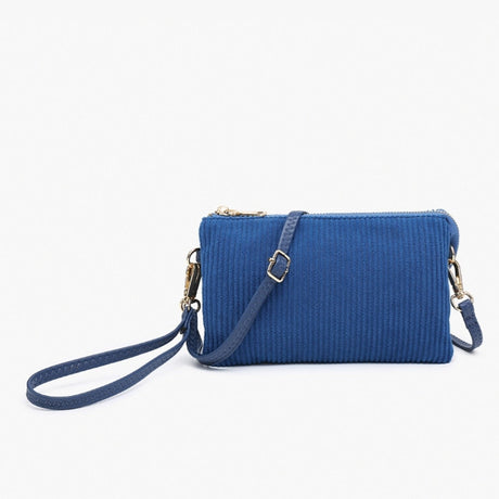 Corduroy Blue textured handbag with a strap on a white background