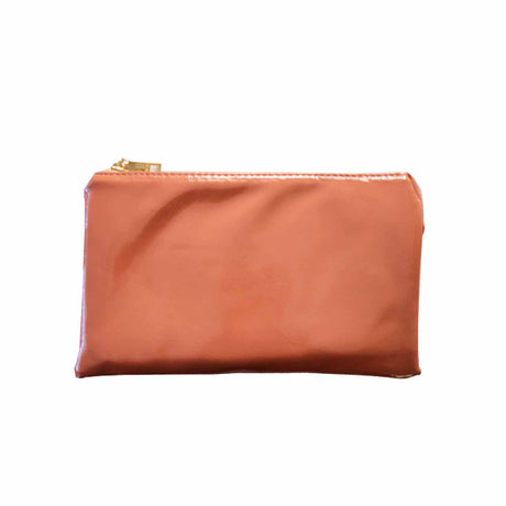 High Gloss Coral pouch with a gold zipper on a white background