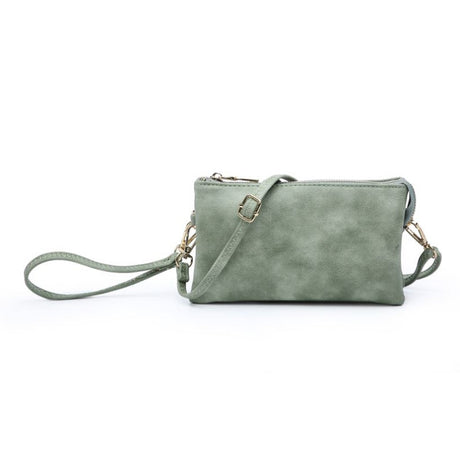 Green handbag with a strap on a white background