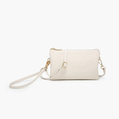 Linen colored handbag with gold accents on a white background