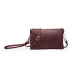 Plum crossbody bag on a white background
