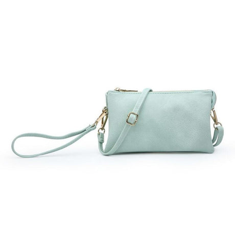 Riley Seafoam handbag with a strap on a white background