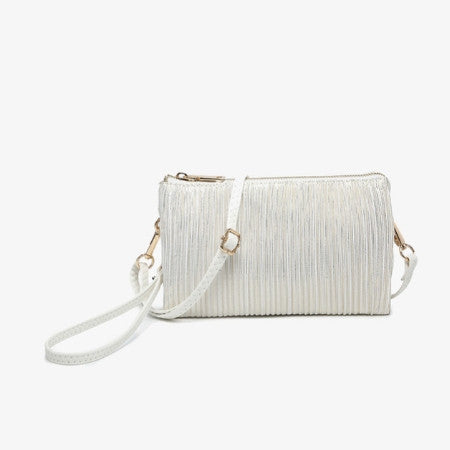 Riley Shimmer Stripe White textured handbag with a strap on a light beige background