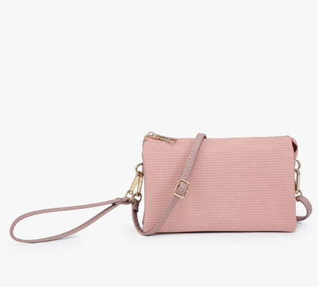 Small Woven Mauve crossbody bag with a strap on a white background