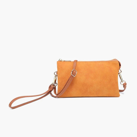Suede Orange crossbody bag with a strap on a white background
