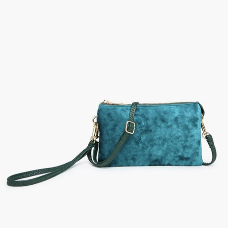 velvet Green handbag with a strap on a white background