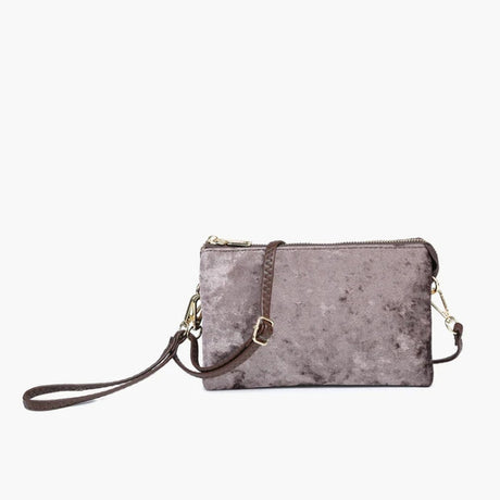 Velvet grey clutch bag with a strap on a white background