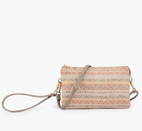 Woven handbag with a strap on a white background