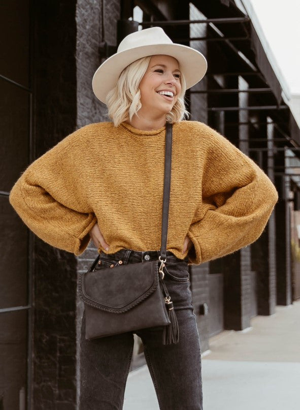 Jen & Co Sloane Flapover Crossbody lifestyle shot in brown