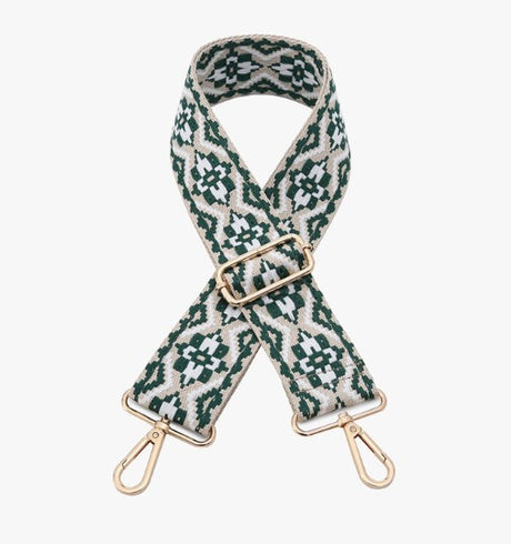 Patterned strap with gold hardware on a white background